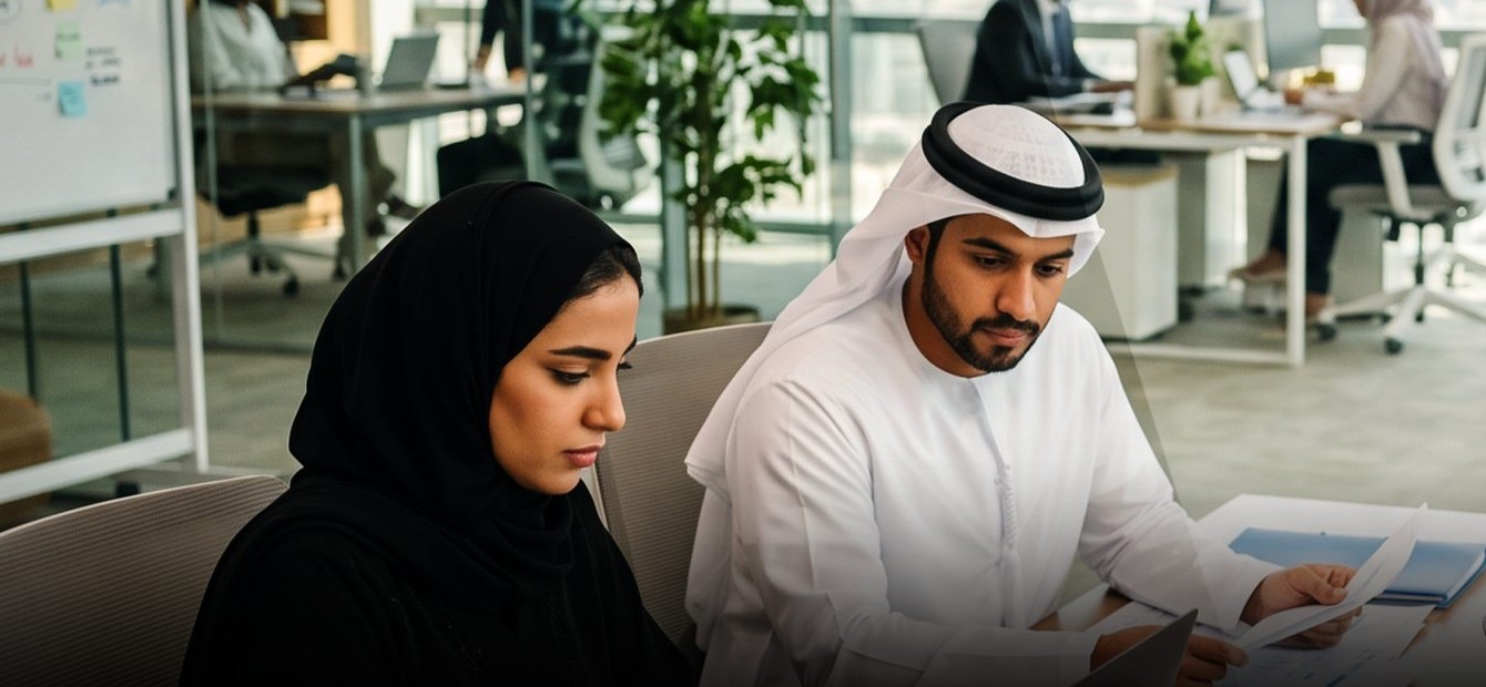 Advisers reviewing a file in the Business Bay office